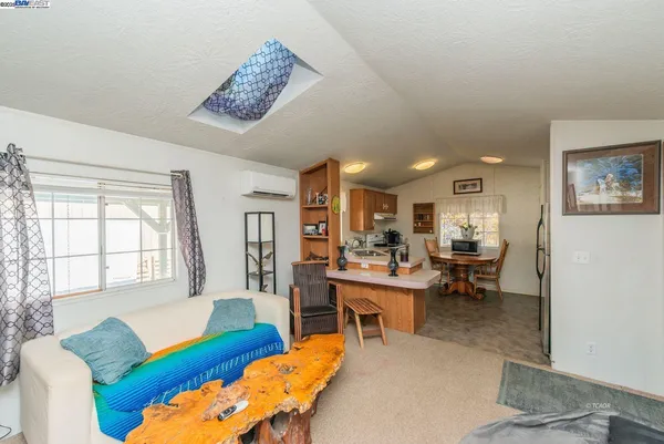 a bed sitting in a room next to a window