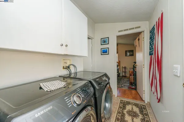 a bathroom with a sink a toilet and shower curtain