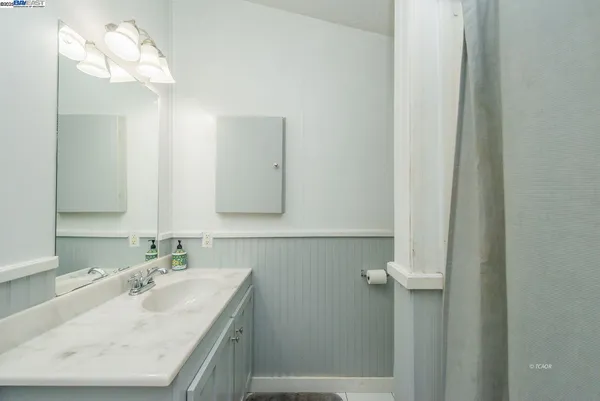 a bedroom with furniture and window