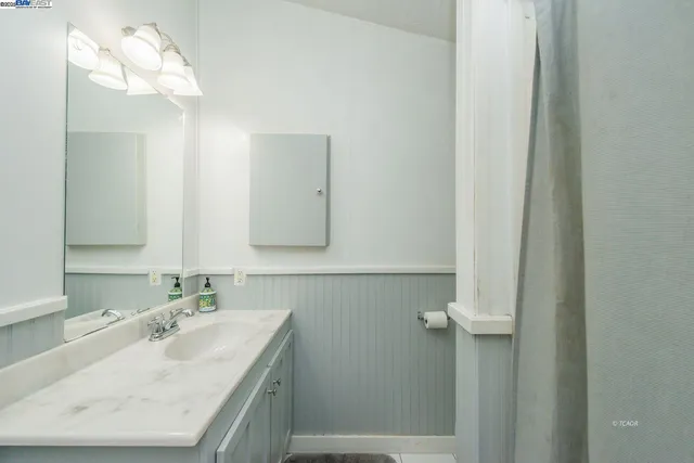 a bedroom with furniture and window