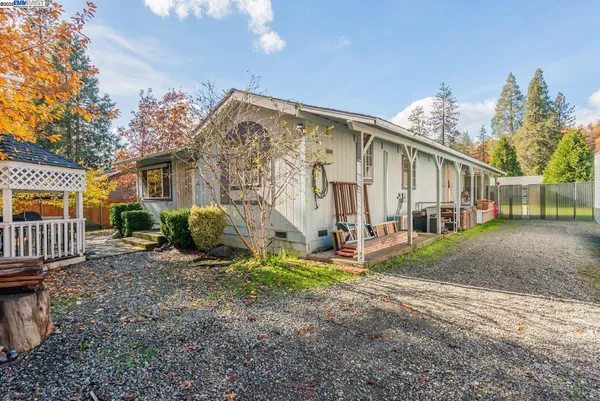 a backyard of a house with seating space