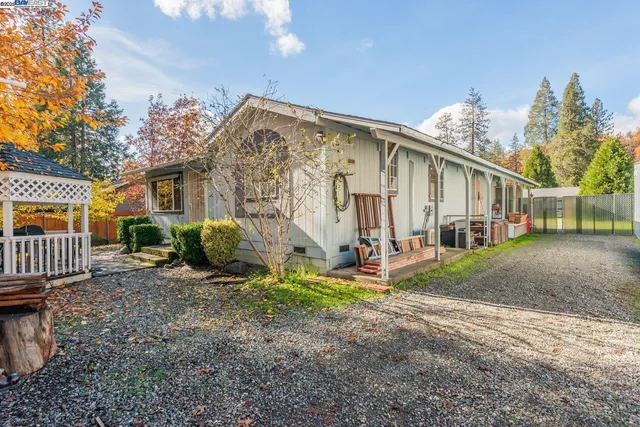 a backyard of a house with seating space