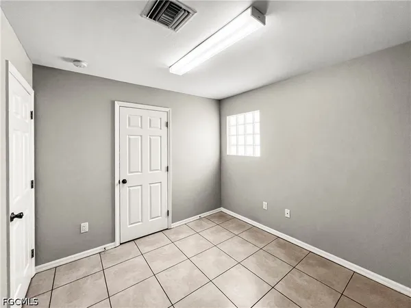 a view of an empty room and window