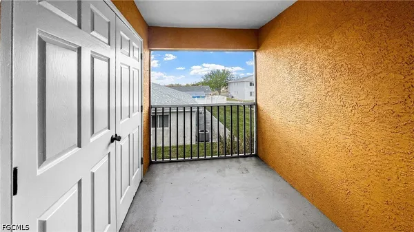 a view of a balcony with wooden floor