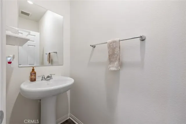 a bathroom with a sink a mirror and shower