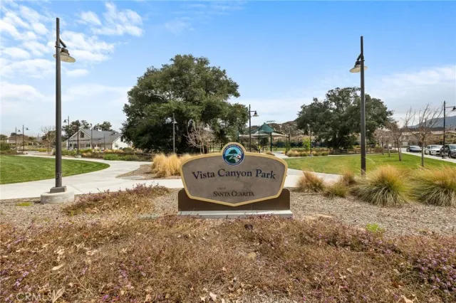 a view of a street with houses on the side
