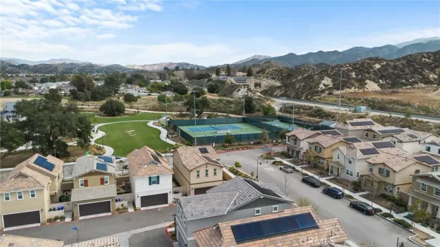 an aerial view of residential houses with outdoor space and river