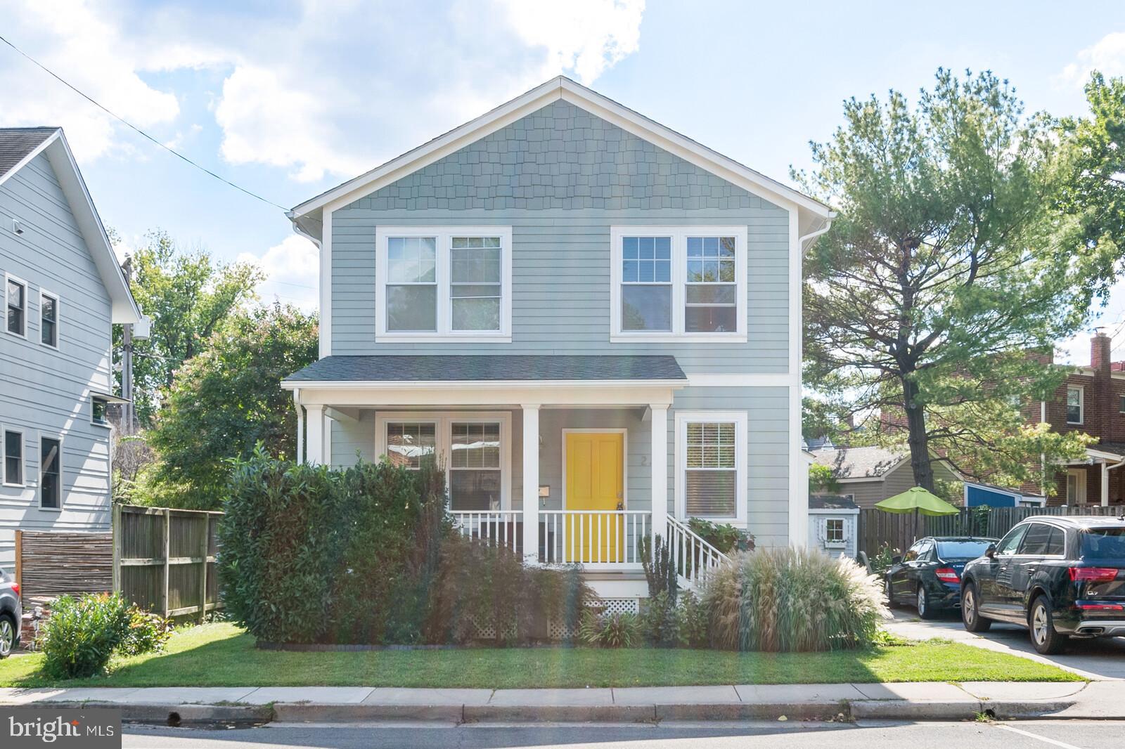 23 East Braddock Road Alexandria, VA 22301 - Photo 1 of 29 a front view of a house with a yard and garage