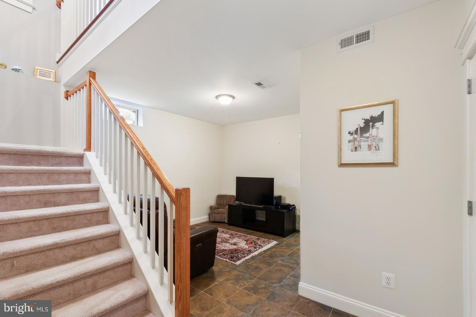 23 East Braddock Road Alexandria, VA 22301 - Photo 14 of 29 a view of a hallway with wooden floor and staircase