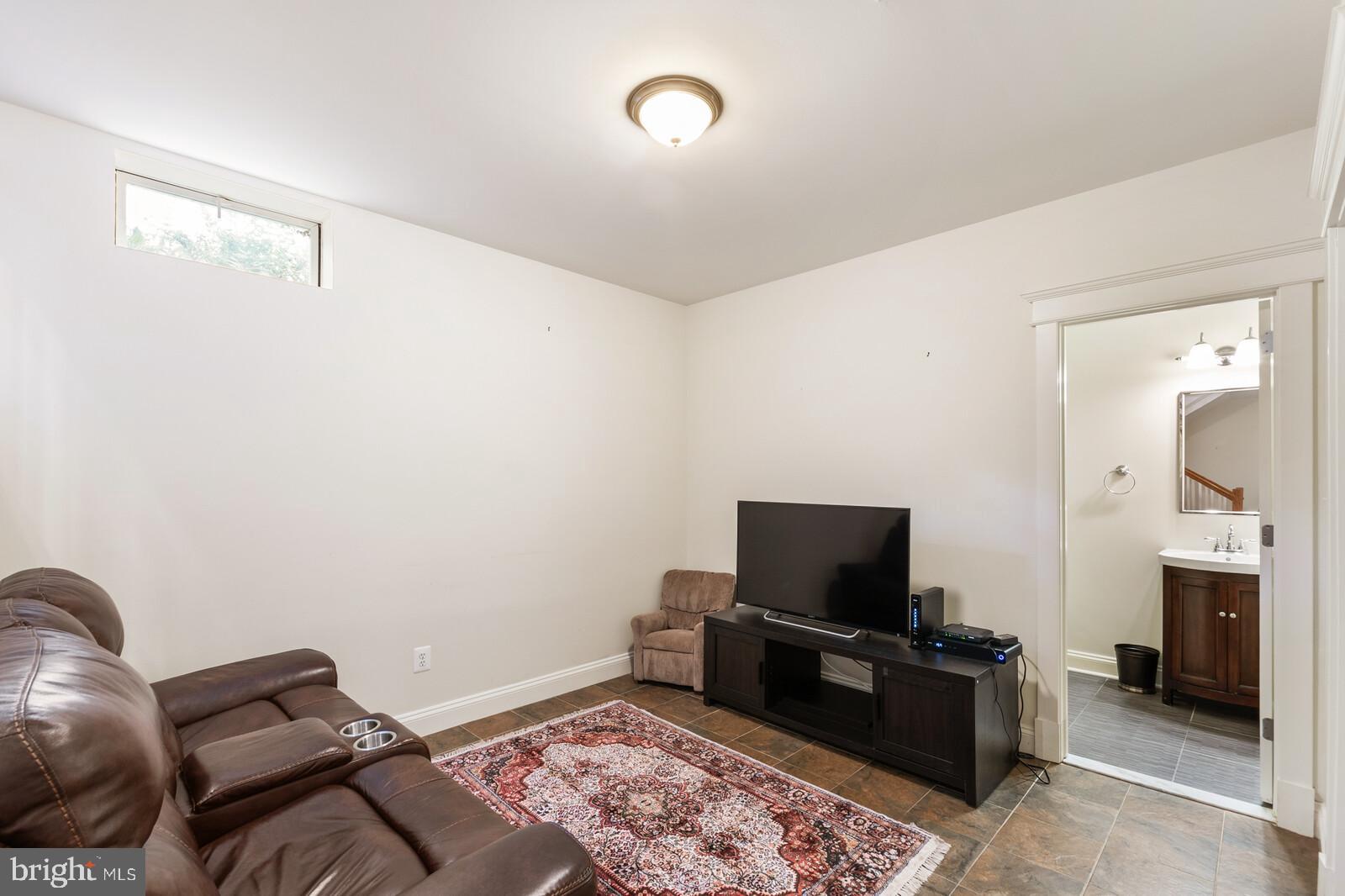 23 East Braddock Road Alexandria, VA 22301 - Photo 15 of 29 a living room with furniture and a flat screen tv
