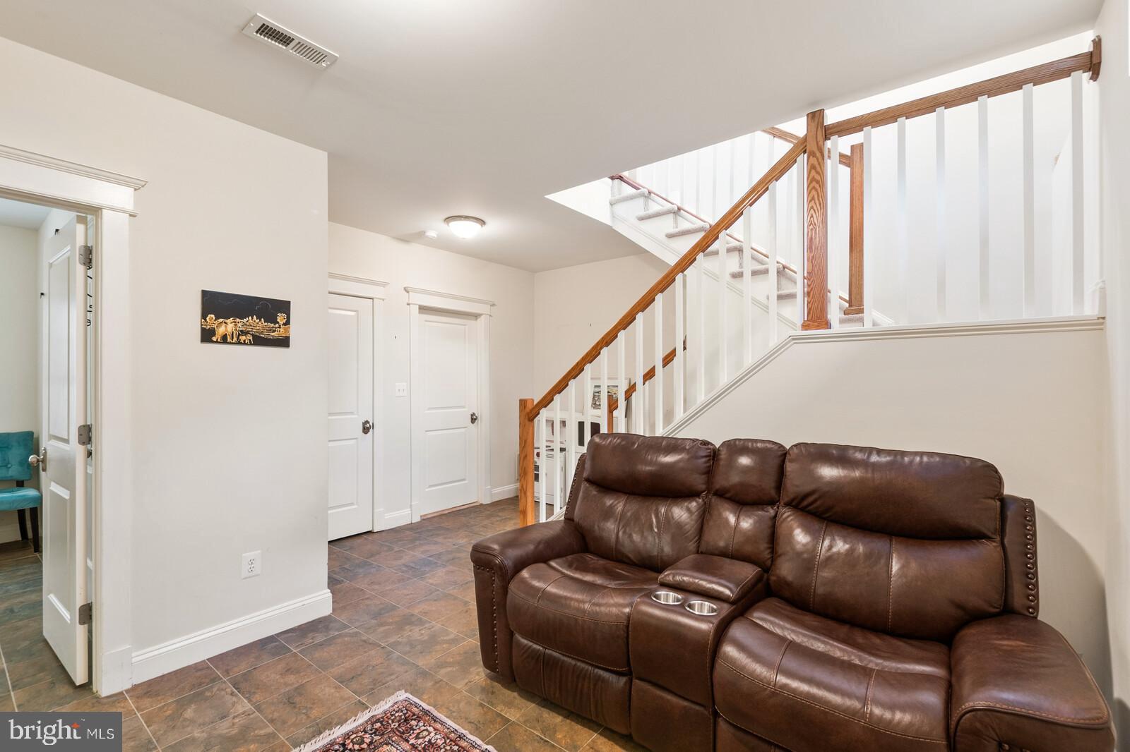 23 East Braddock Road Alexandria, VA 22301 - Photo 16 of 29 a living room with furniture and stairs
