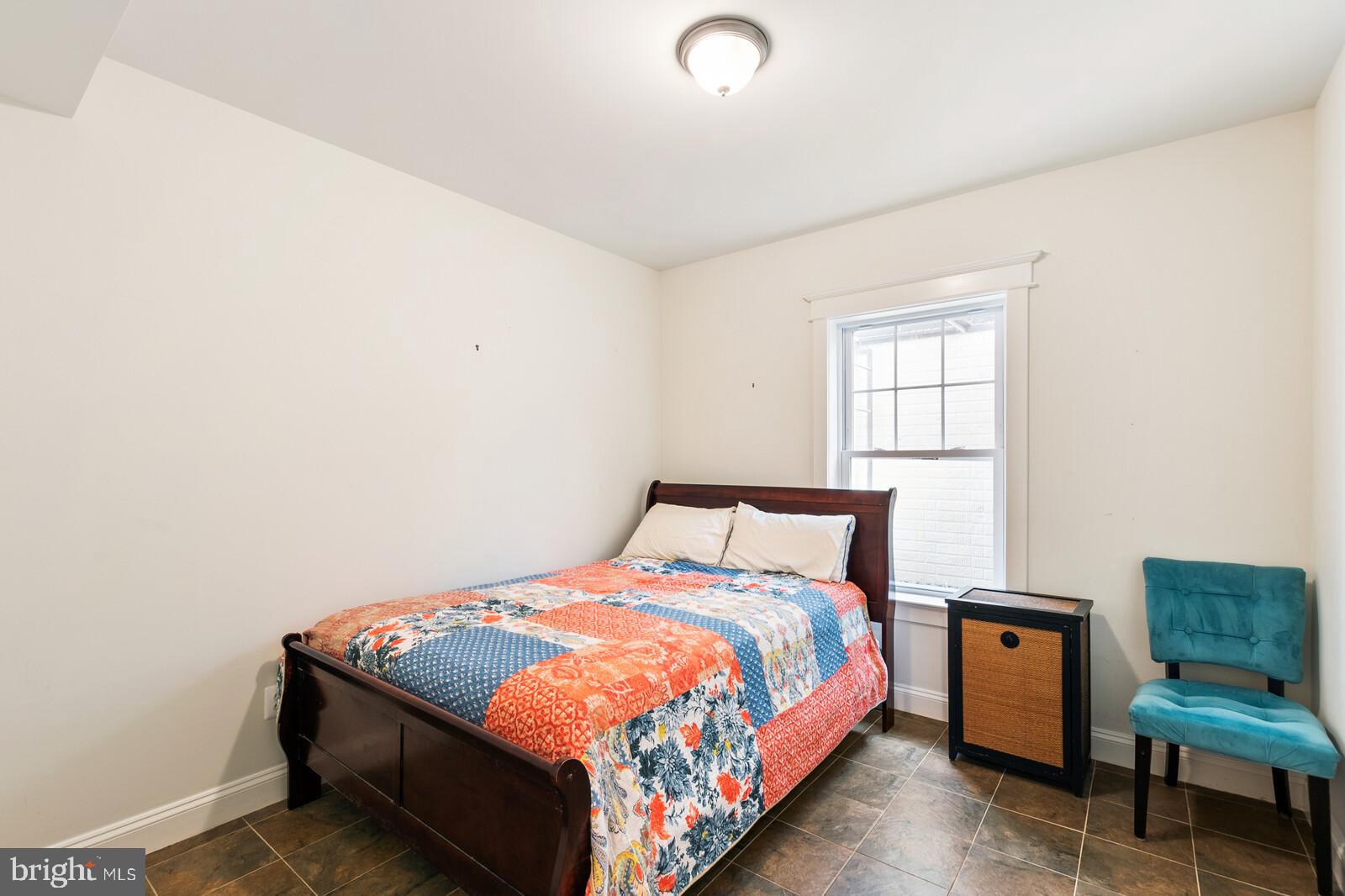 23 East Braddock Road Alexandria, VA 22301 - Photo 17 of 29 a bedroom with a bed and chair
