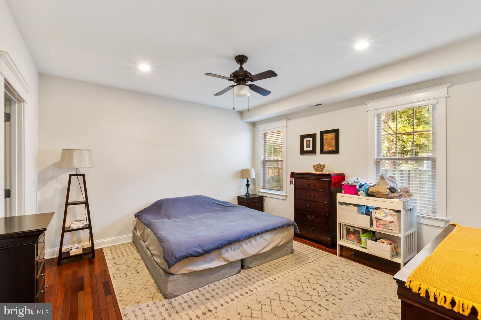 23 East Braddock Road Alexandria, VA 22301 - Photo 20 of 29 a bedroom with a bed and wooden floor
