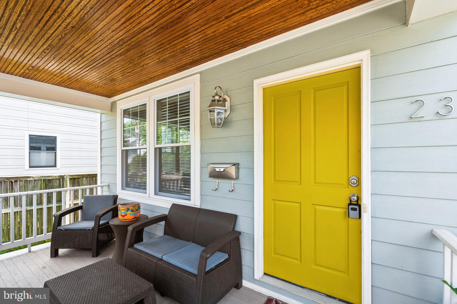 23 East Braddock Road Alexandria, VA 22301 - Photo 3 of 29 a balcony with furniture and a window