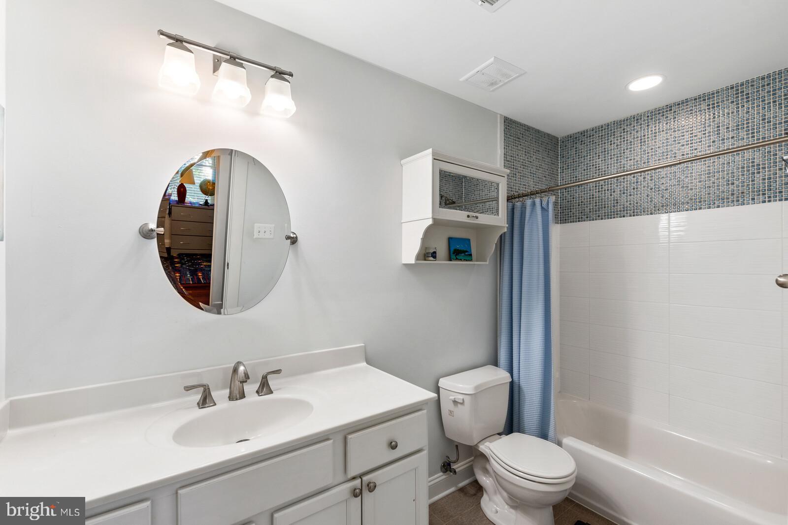 23 East Braddock Road Alexandria, VA 22301 - Photo 26 of 29 a bathroom with a toilet a sink and a mirror