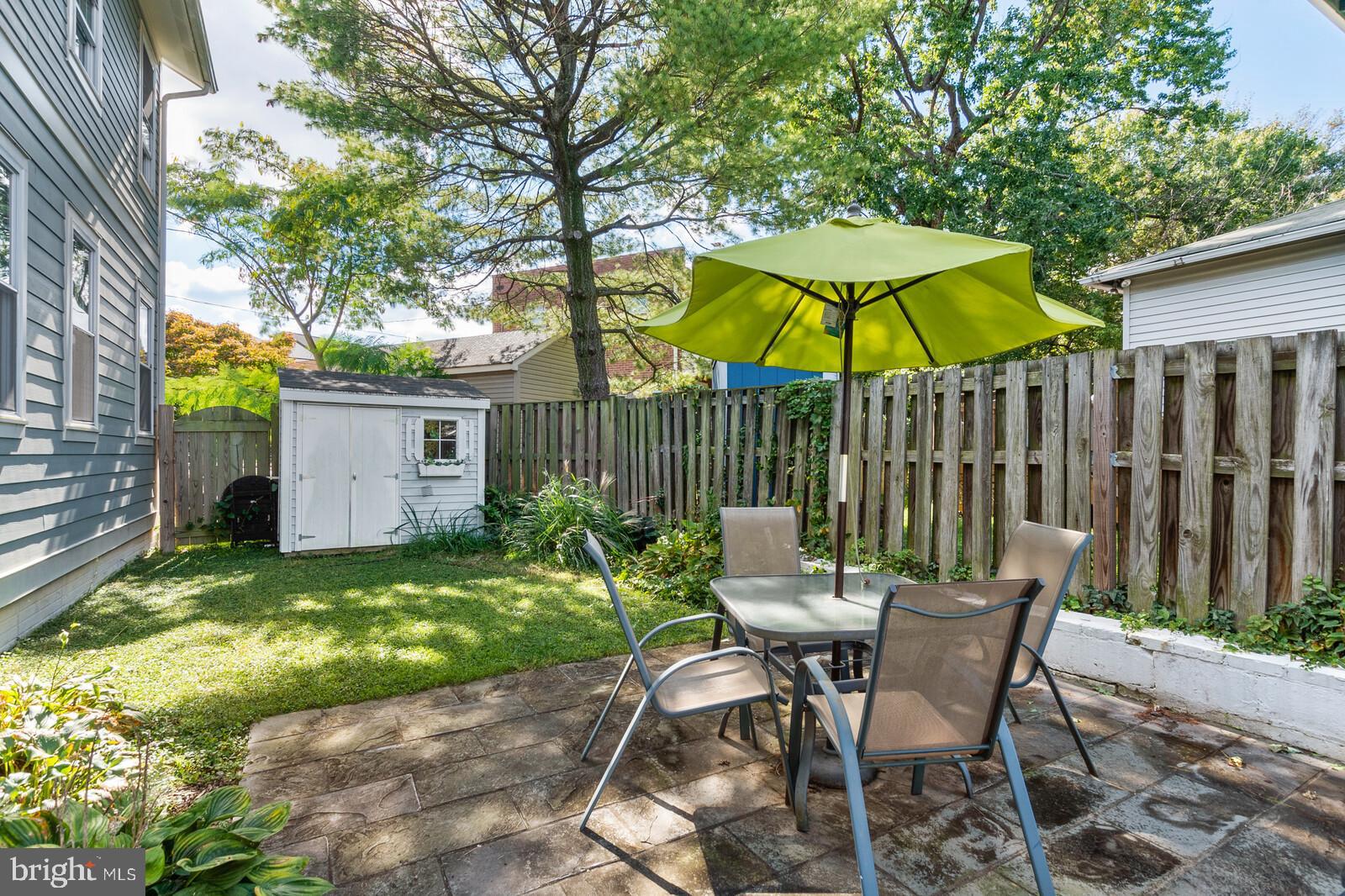 23 East Braddock Road Alexandria, VA 22301 - Photo 28 of 29 a view of a chair and table in the backyard
