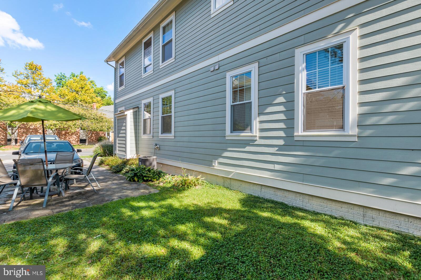 23 East Braddock Road Alexandria, VA 22301 - Photo 29 of 29 a backyard of a house with table and chairs