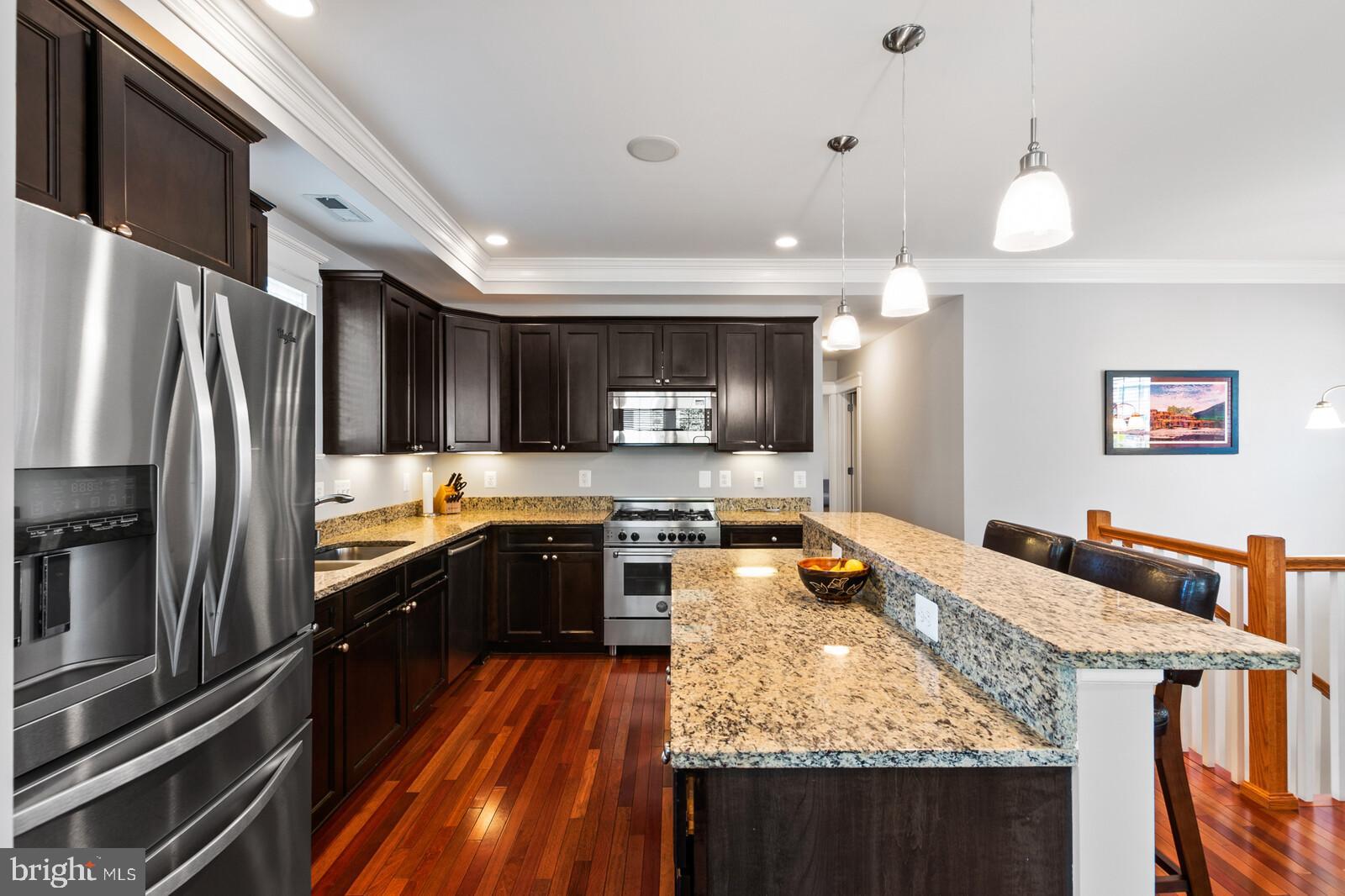 23 East Braddock Road Alexandria, VA 22301 - Photo 10 of 29 a large kitchen with a center island and stainless steel appliances
