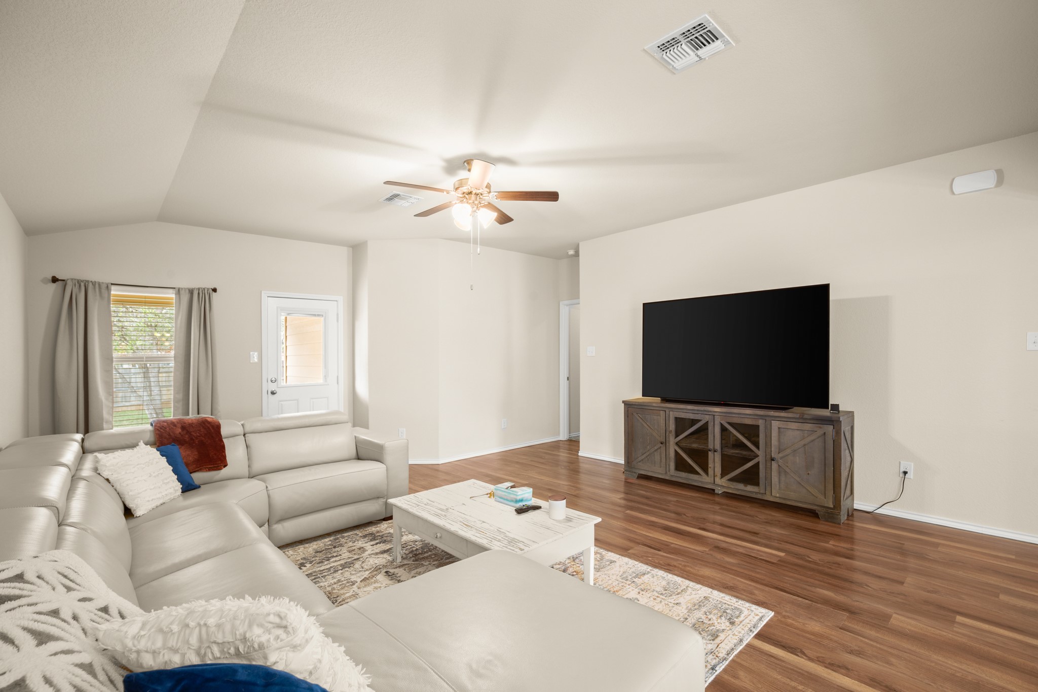 5526 Perdita Drive Belton, TX 76513 - Photo 8 of 26 Living area with a ceiling fan, wood finished floors, and vaulted ceiling