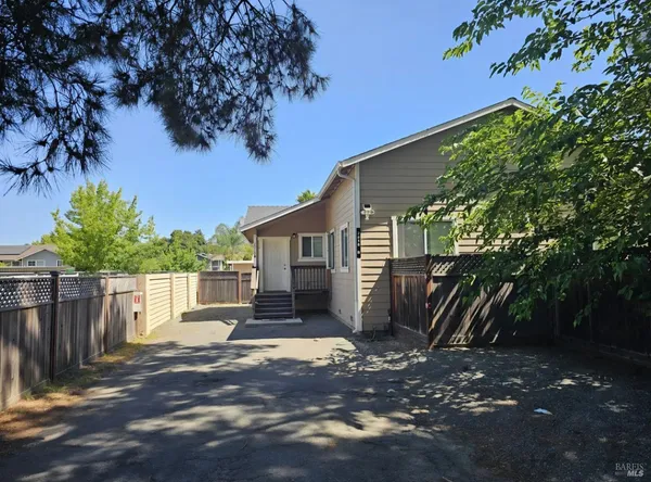 a view of a house with a tree
