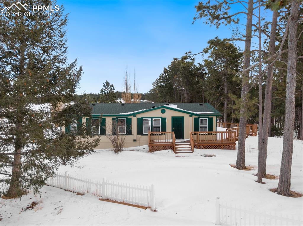 16625 Roller Coaster Road Colorado Springs, CO 80921 - Photo 1 of 44 a front view of a house with a yard