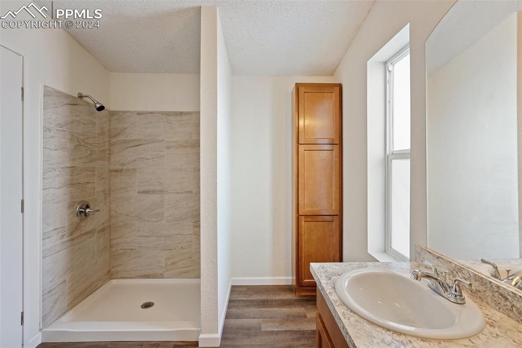 16625 Roller Coaster Road Colorado Springs, CO 80921 - Photo 11 of 44 a bathroom with a bathtub and a sink