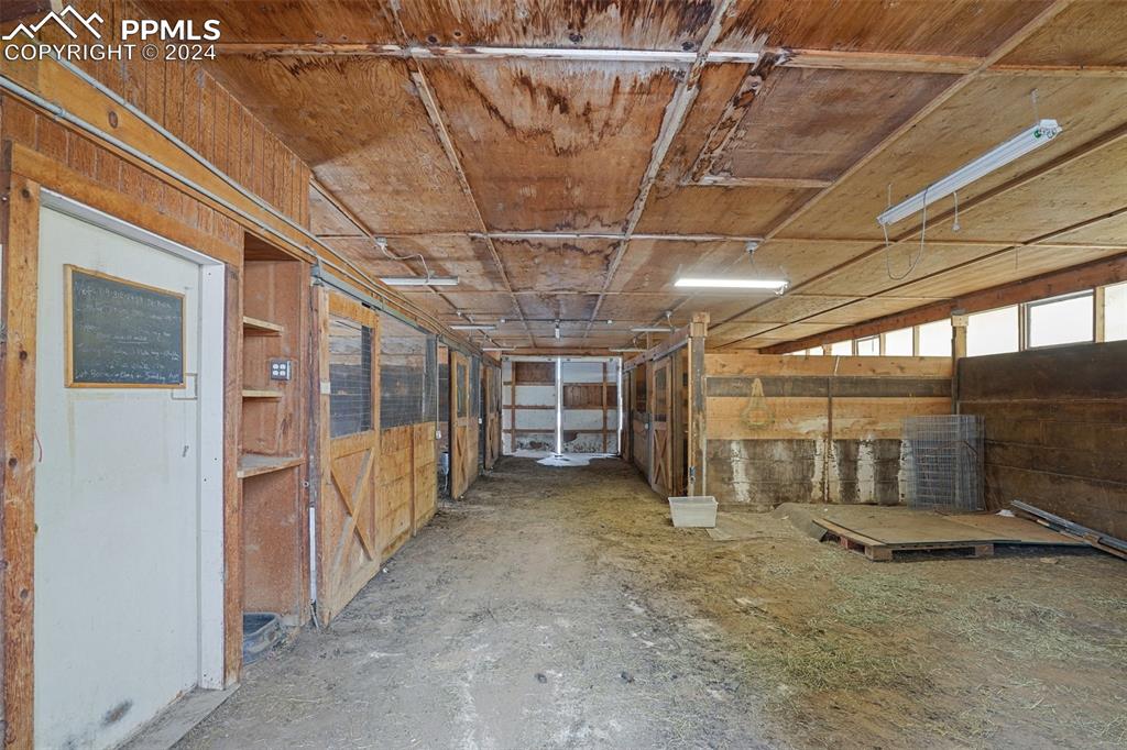 16625 Roller Coaster Road Colorado Springs, CO 80921 - Photo 34 of 44 a view of an empty room with wooden walls