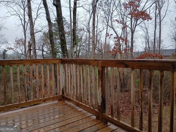 a view of deck with wooden floor and fence