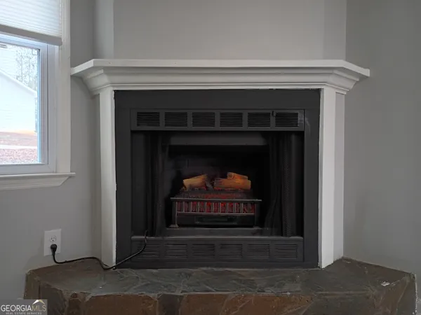 a living room with a fireplace