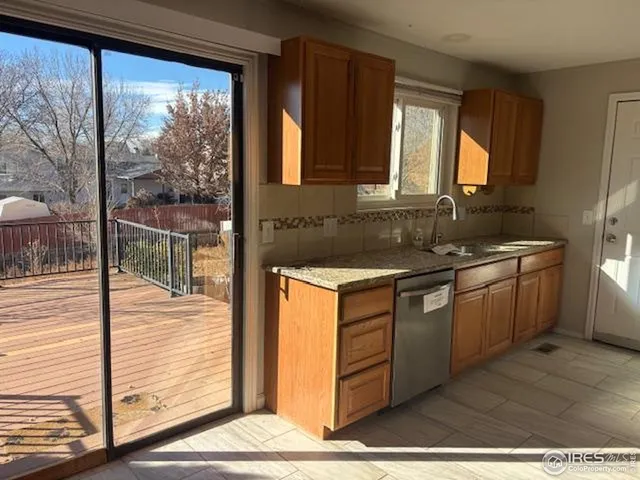 a kitchen with a sink and large window
