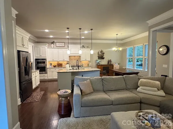 a living room with a table and a window