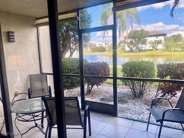 a view of a chairs and table in the balcony