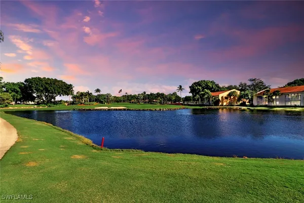 a view of a lake and outdoor seating