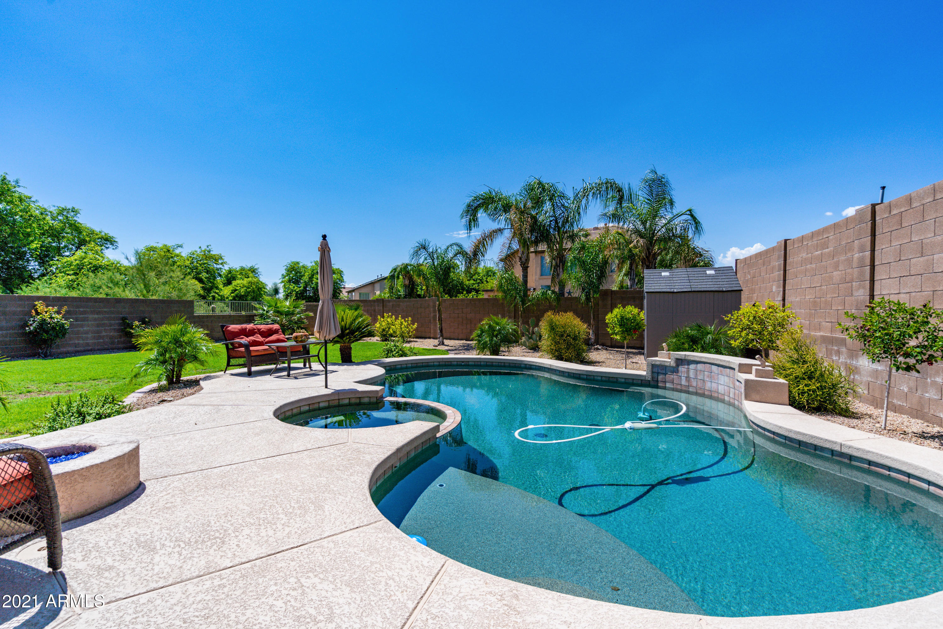 28726 North Nobel Road Phoenix, AZ 85085 - Photo 14 of 14 a view of a swimming pool and lounge chair
