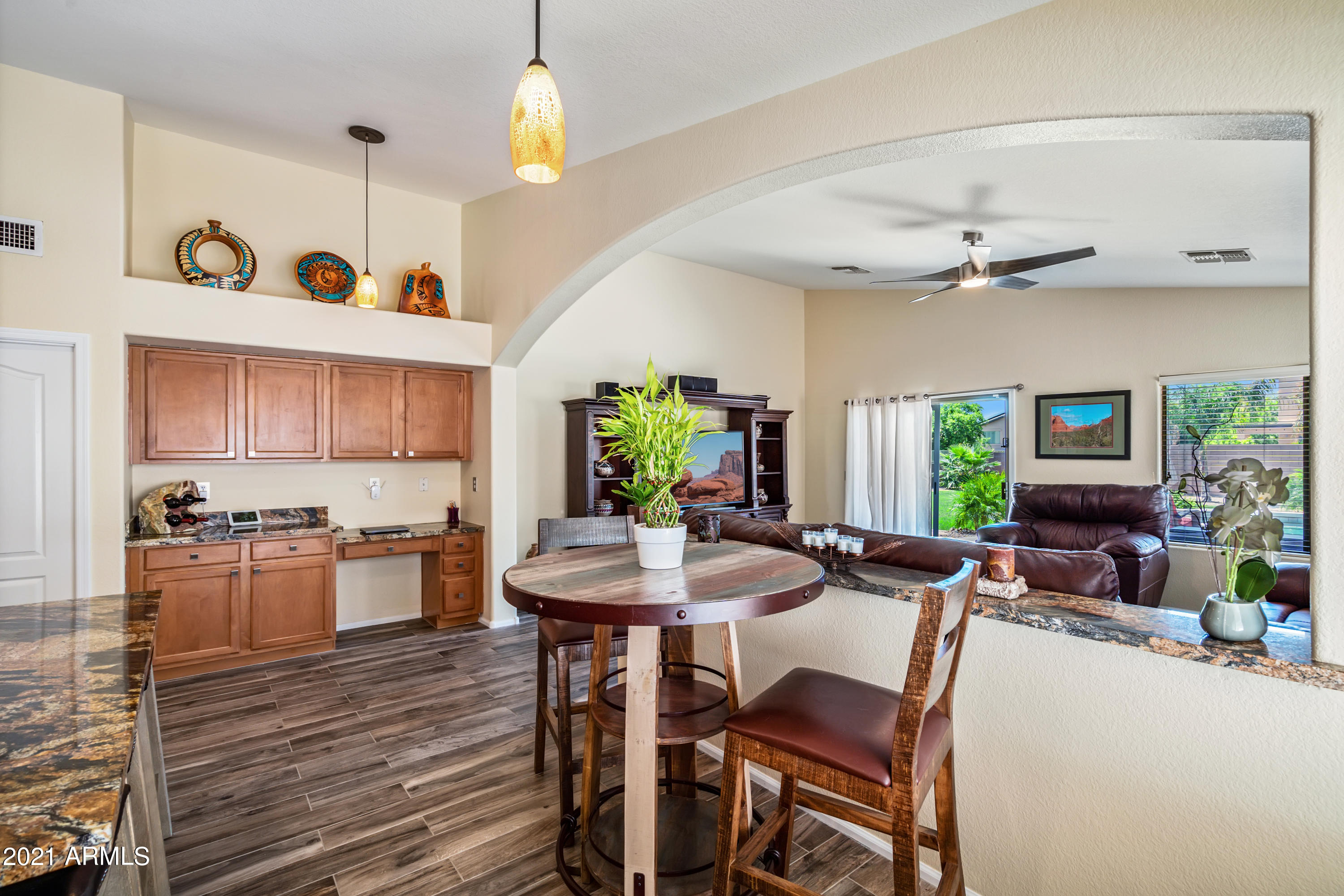 28726 North Nobel Road Phoenix, AZ 85085 - Photo 4 of 14 a view of a dining room with furniture window and wooden floor
