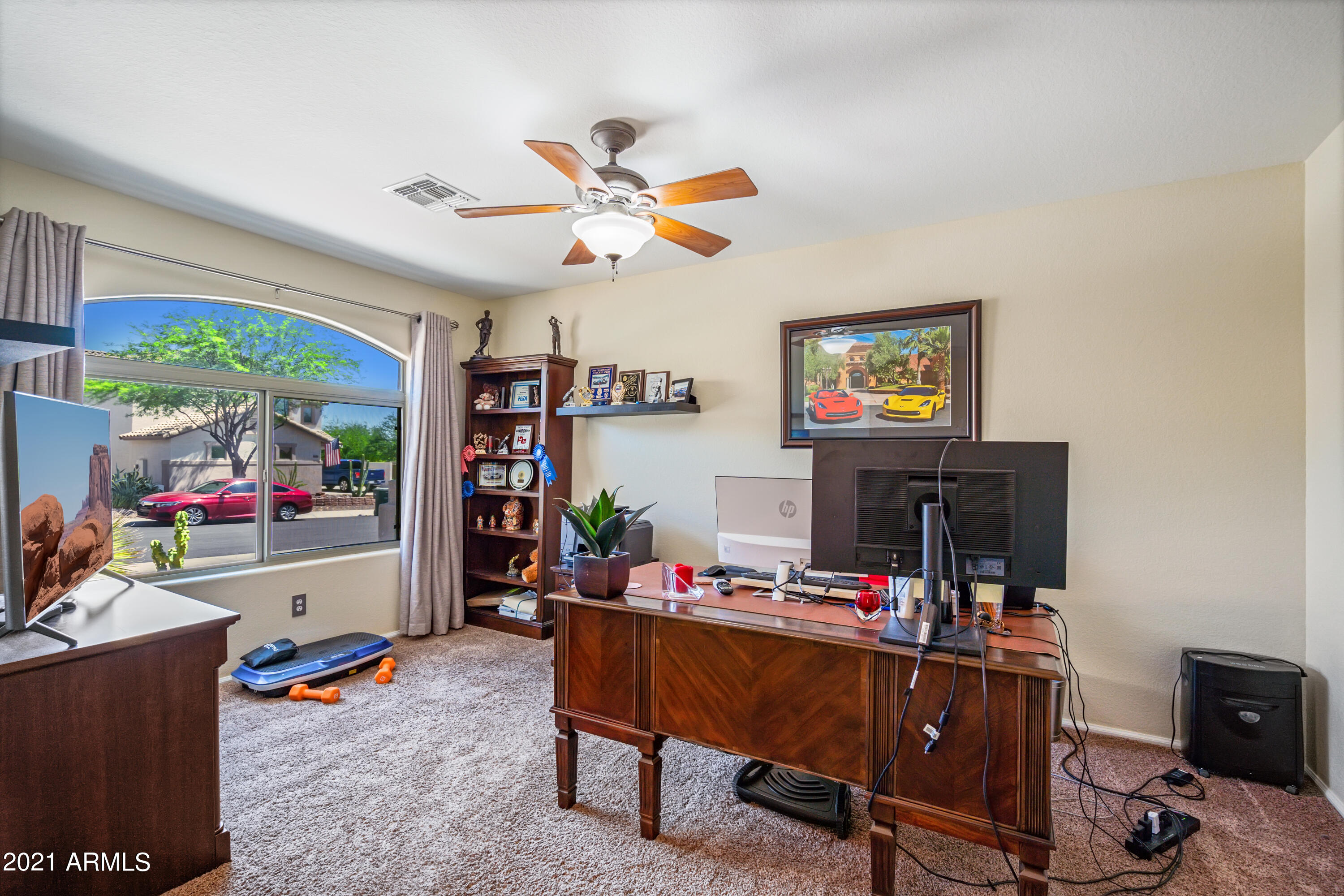 28726 North Nobel Road Phoenix, AZ 85085 - Photo 8 of 14 a living room with furniture and a flat screen tv