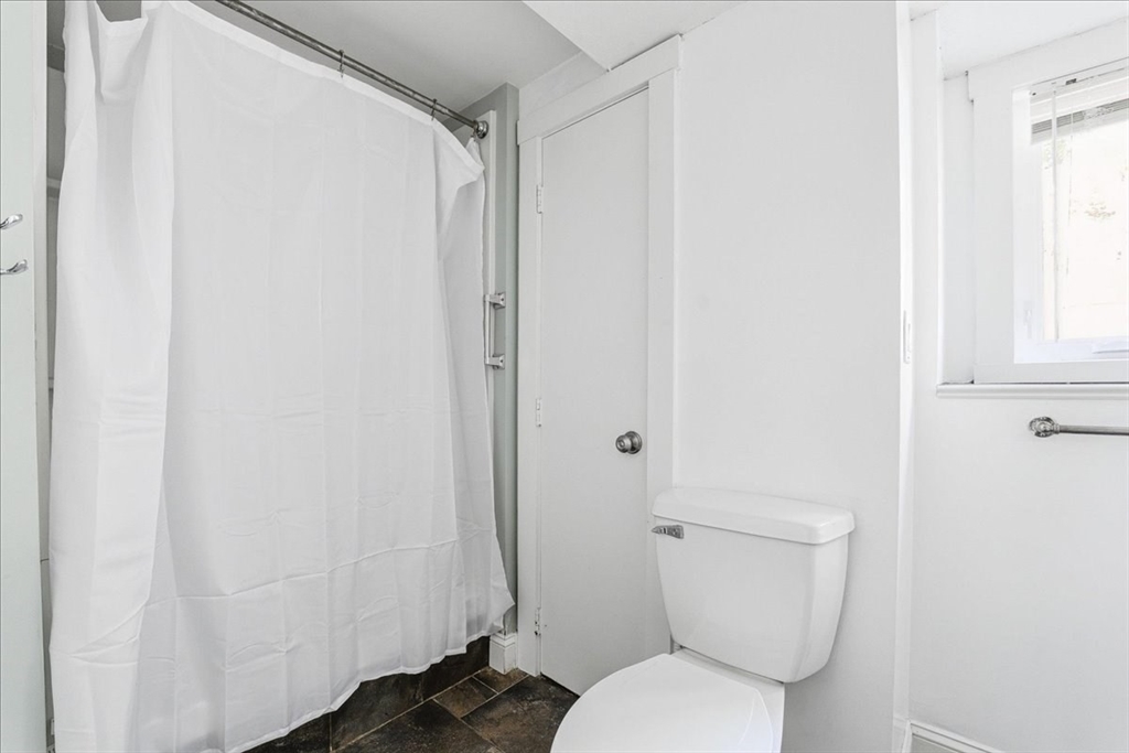 179 Hedges Pond Road Plymouth, MA 02360 - Photo 18 of 18 a white toilet sitting next to a shower