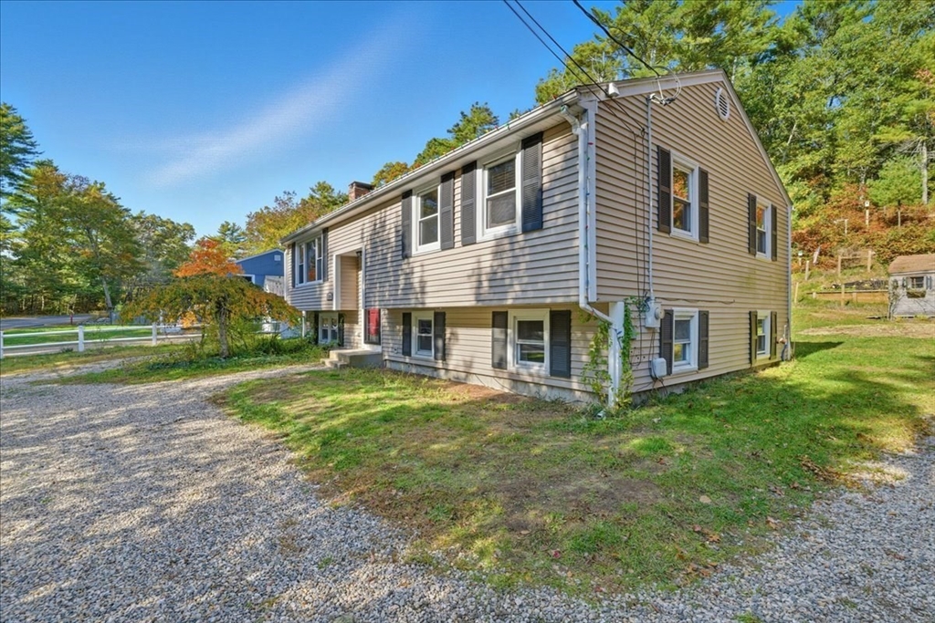 179 Hedges Pond Road Plymouth, MA 02360 - Photo 3 of 18 a view of a house with backyard and trees