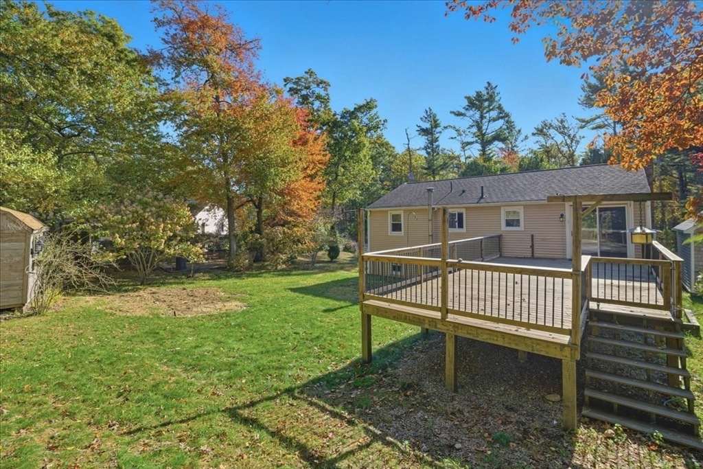 179 Hedges Pond Road Plymouth, MA 02360 - Photo 4 of 18 a view of a house with a yard