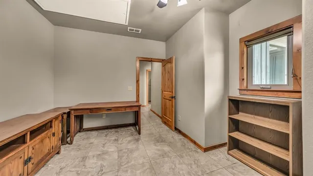 a view of furniture and window in a room