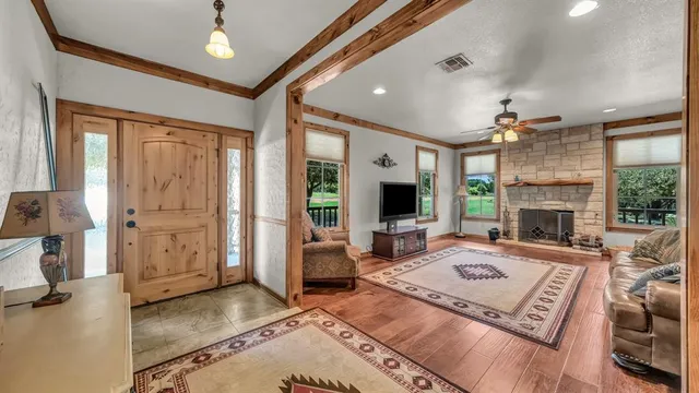 a living room with furniture and a fireplace