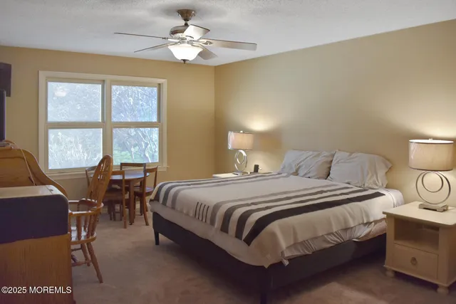 a bathroom with a double vanity sink toilet and shower