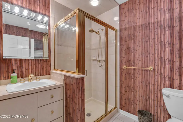 a bedroom with a rug and wooden floor