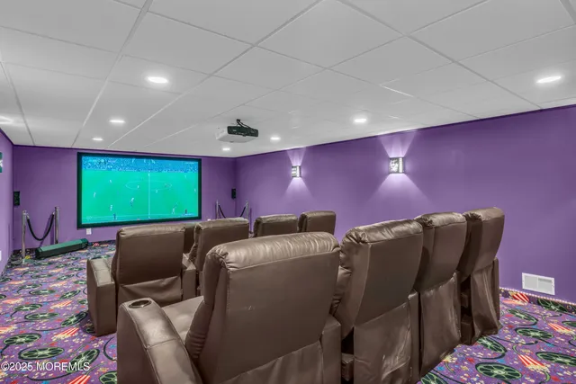 a patio with sofas table and chairs