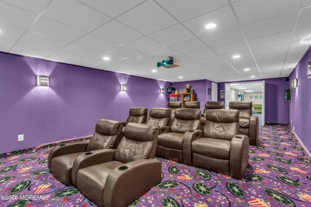a patio with couches table and chairs under an umbrella