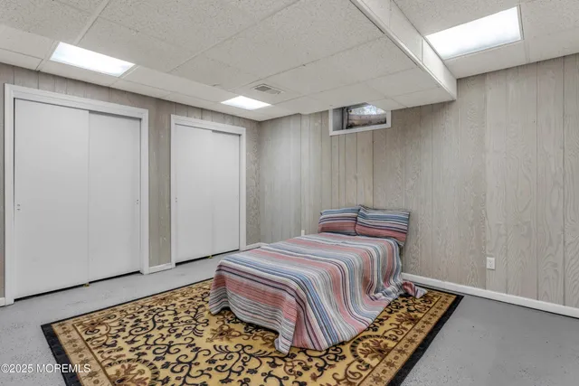 an aerial view of a house with a yard basket ball court and outdoor seating