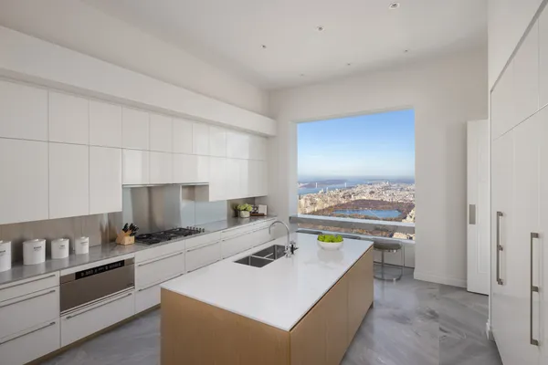 a kitchen that has a sink and a stove