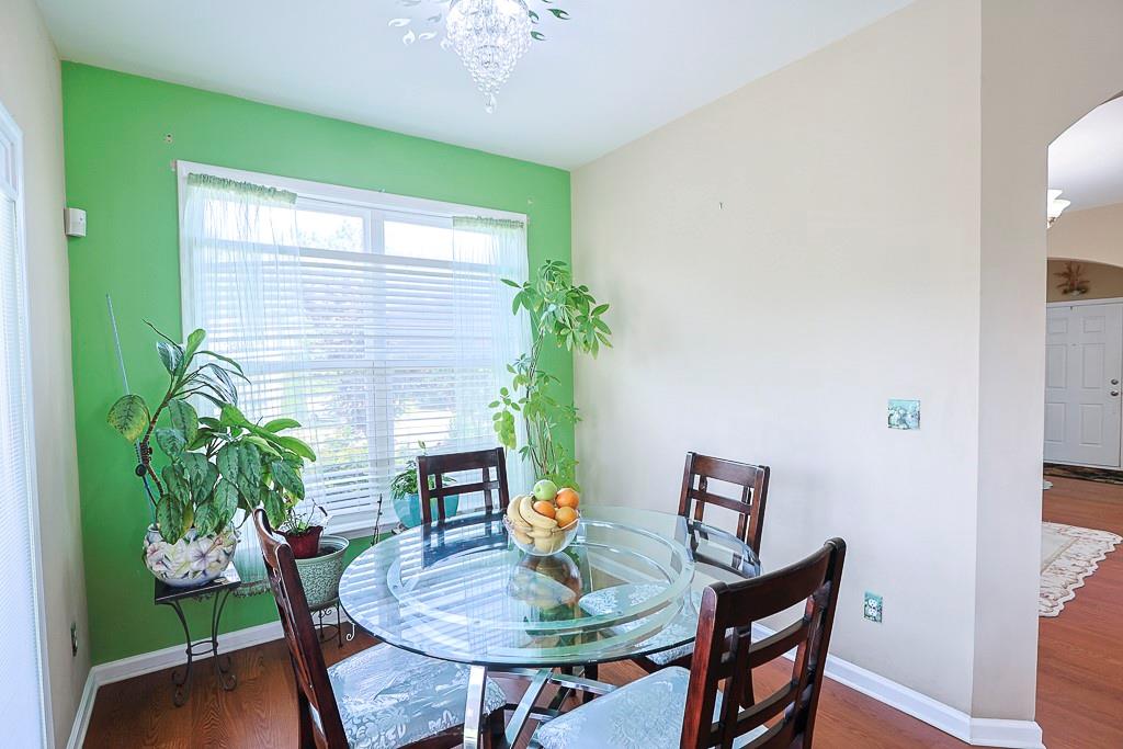 300 Hampton Place Canton, GA 30115 - Photo 23 of 82 a dining room with furniture and a potted plant