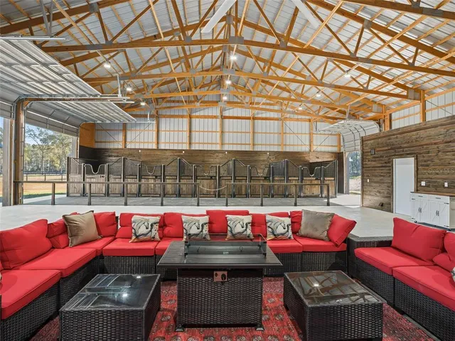 a outdoor space with patio couches and a table and chairs