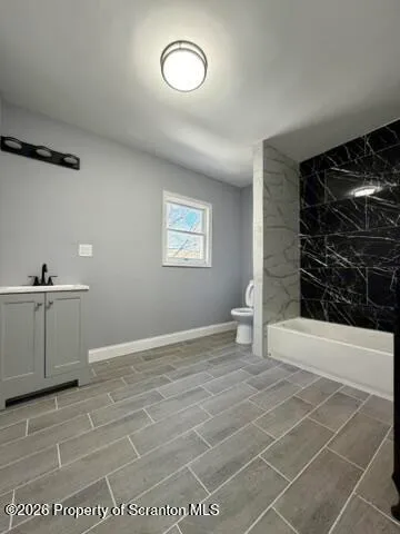 a view of an empty room with a sink